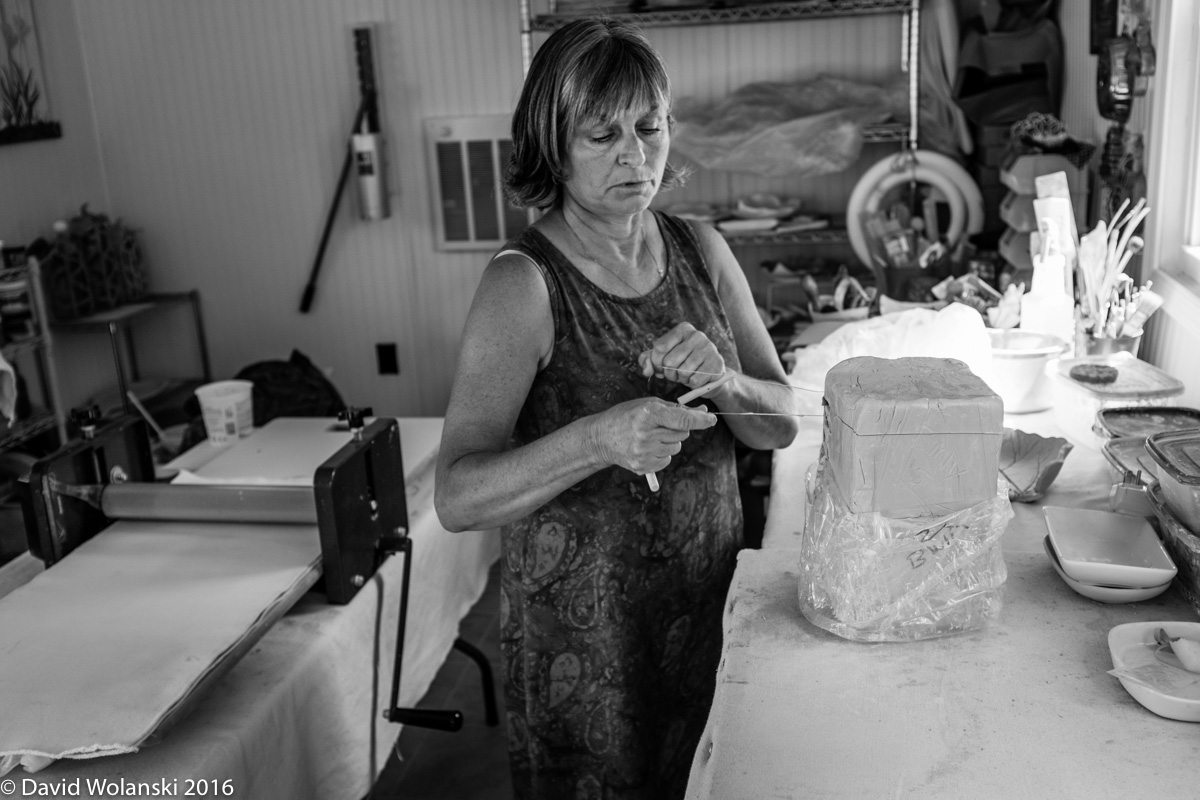 Maria Sadler cutting clay